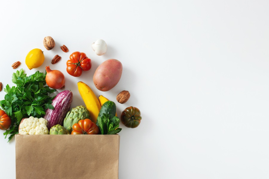 vegetables and fruits in a paper bag
