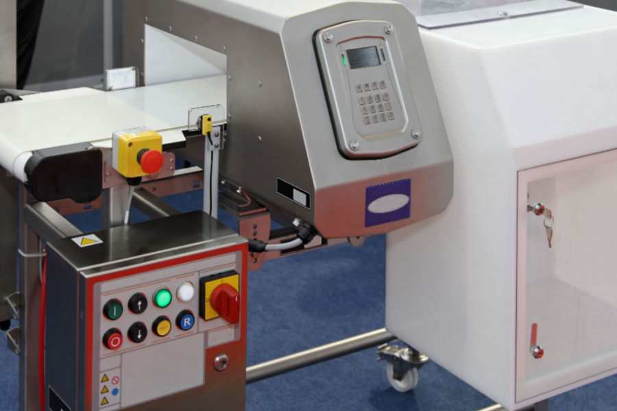 metal detector at production line in food factory