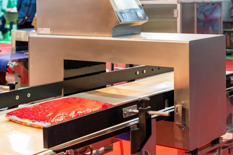 meat bag on conveyor metal detector machine