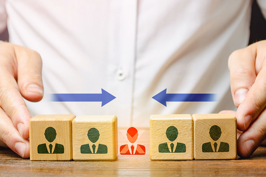 businessman merging blocks of wooden cube with human icon