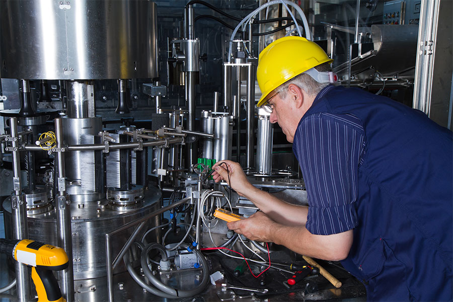 technician having a regular maintenance of color sorting machine