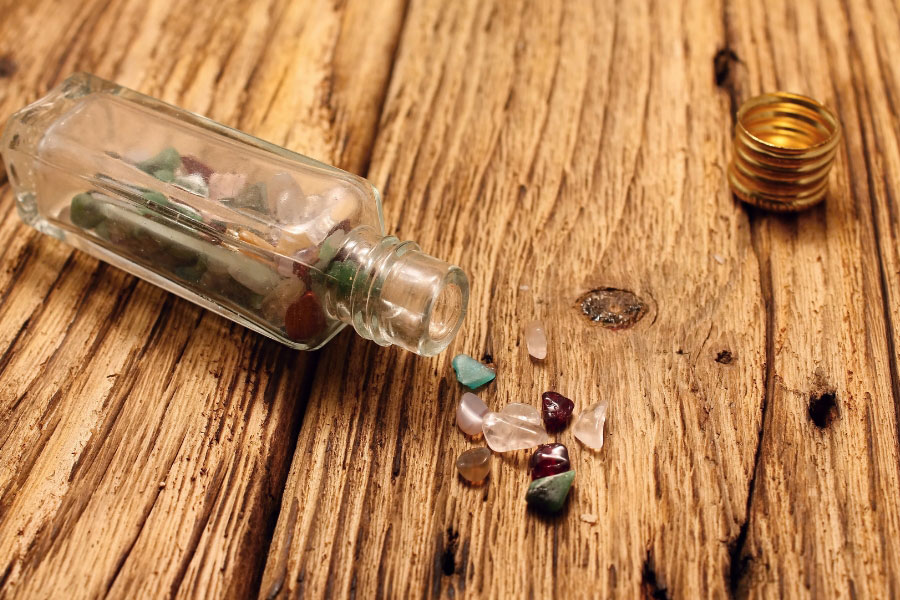 small bottle with stones and pebbles