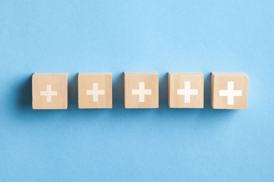 plus sign printed on wooden cubes
