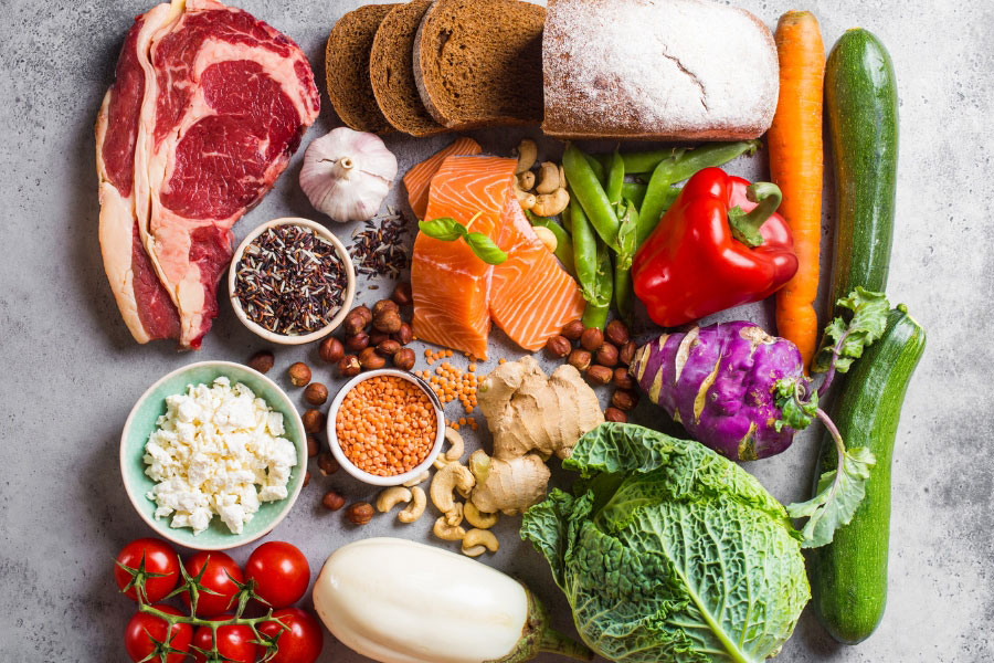 raw meat products and vegetables on table