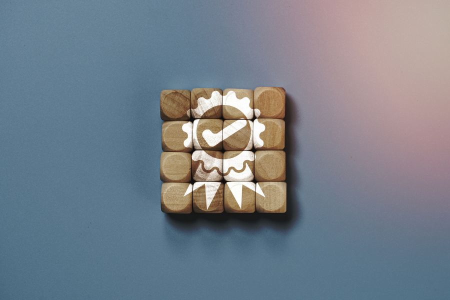 quality assurance icon printed on wooden cube