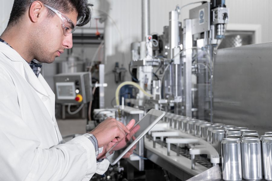 man not wearing proper protective equipment in production facility