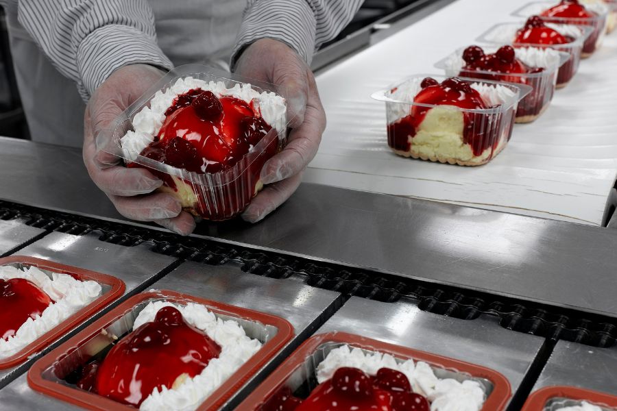 employee working on food packaging line