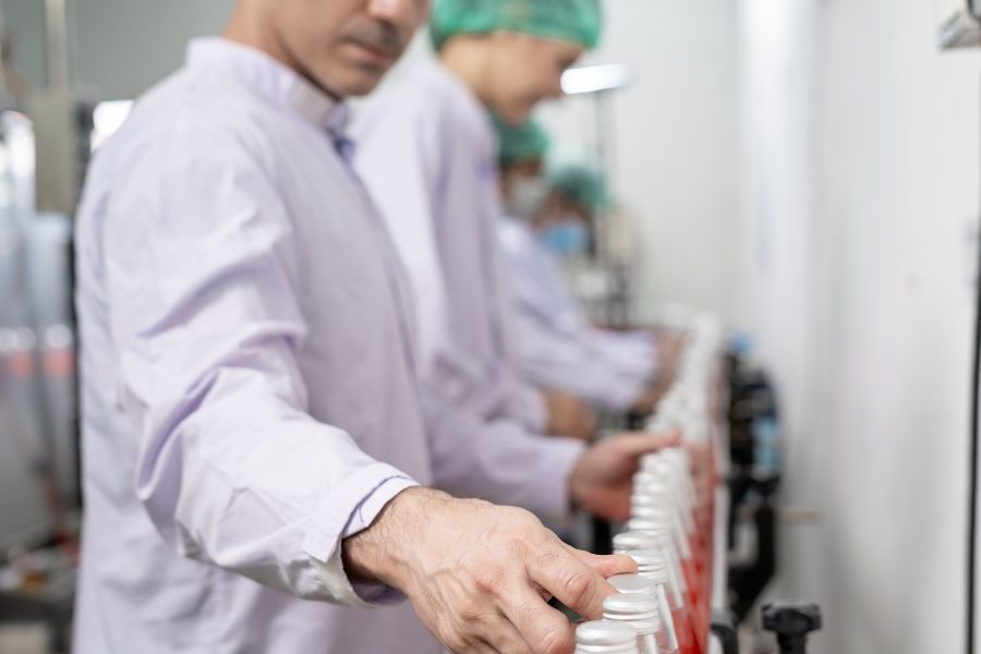 food quality inspector checking bottled products