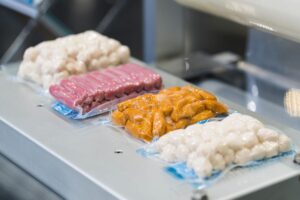 sealed frozen food products on top of machine