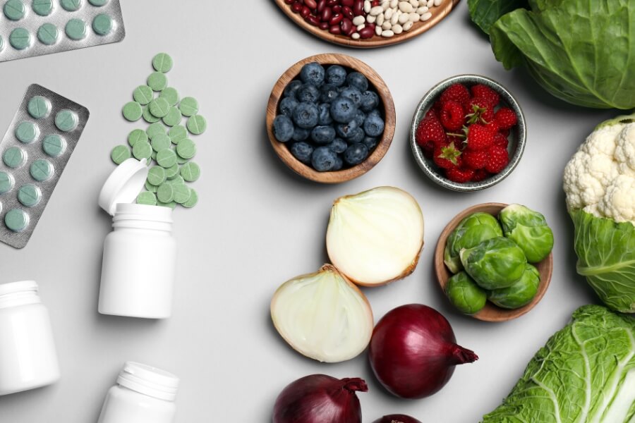 different vegetables and medical tablets