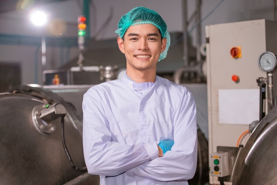 smiling food inspection operator
