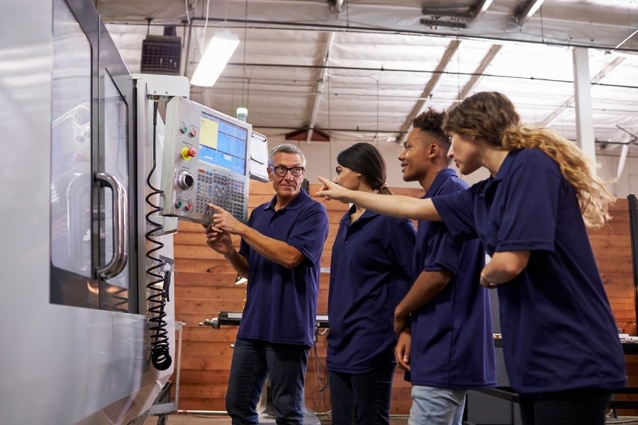 trainer teaching horizontal and vertical fill systems to apprentices