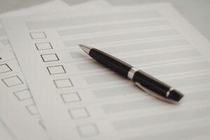ballpen on top of checklist
