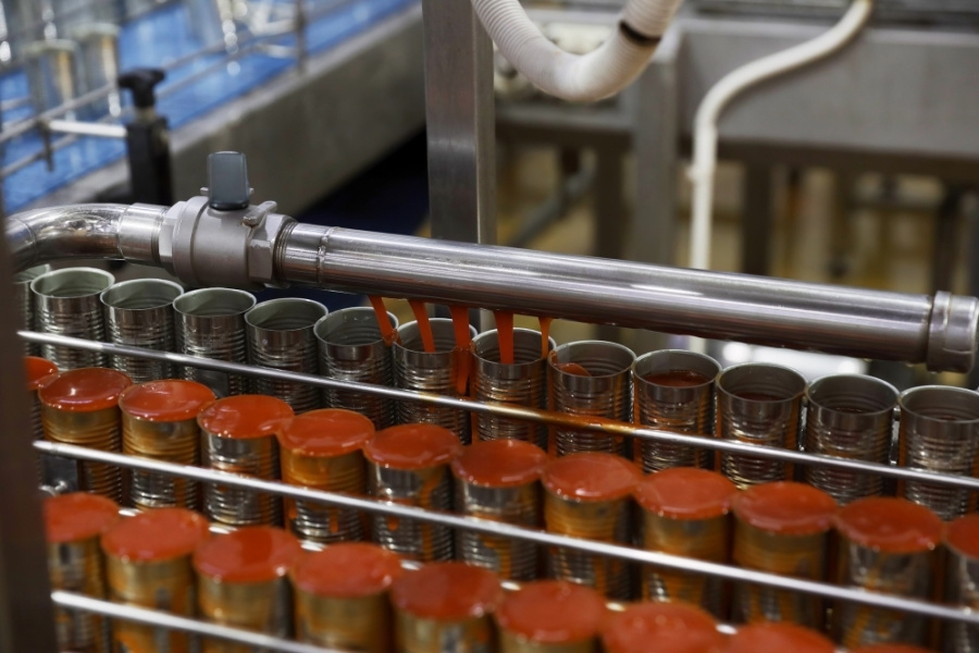 cans filled up in food manufacturing facility