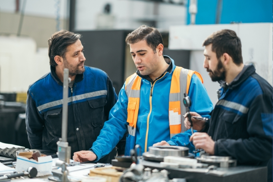 engineers discussing about checkweigher drift